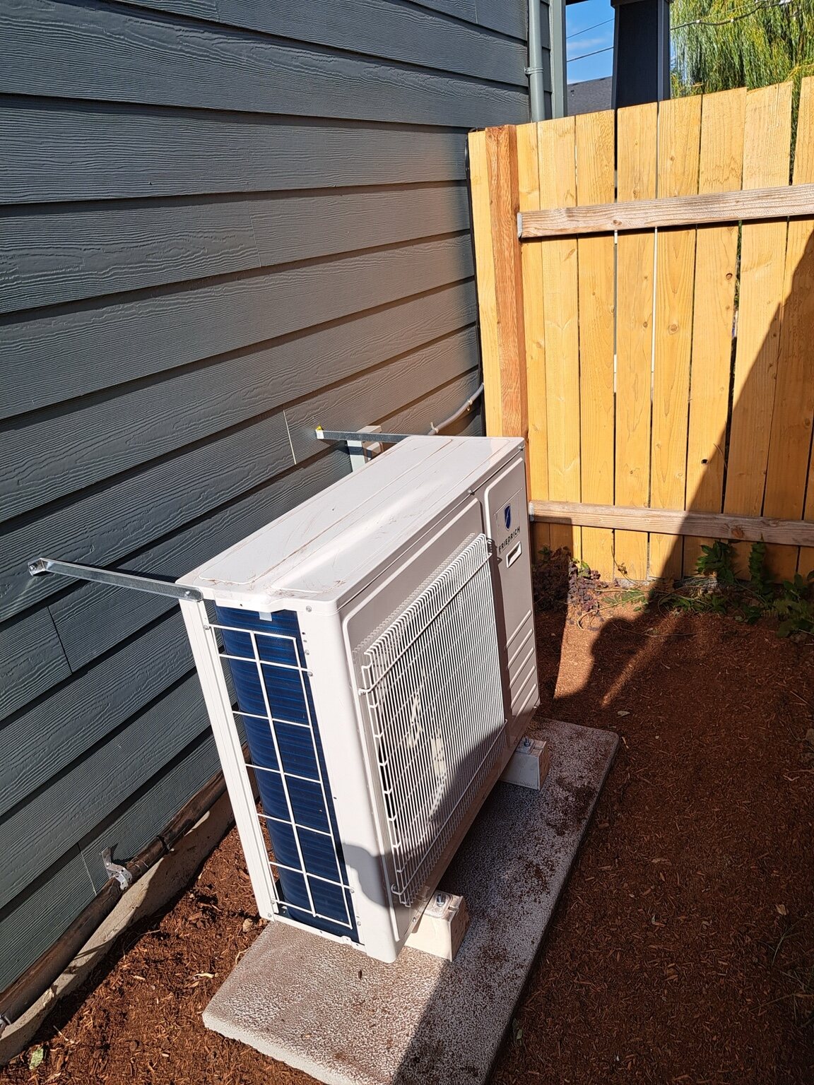 Side-discharge heat pump installation by Tranquility Heating and Cooling
